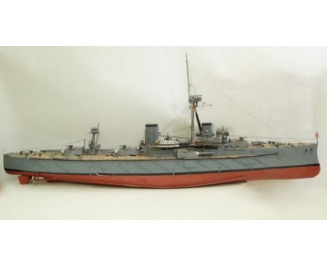 A large scale model of an unnamed British battleship in camouflage colours, 170cm long 