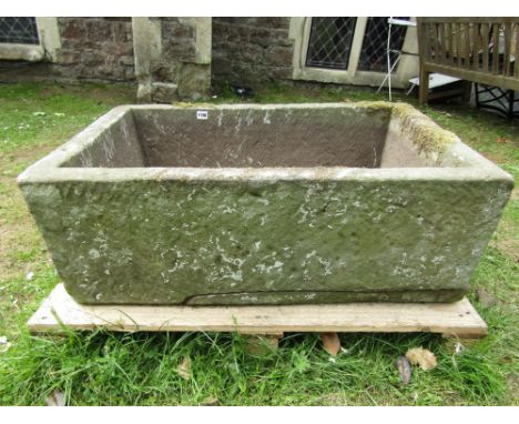 A natural stone trough of rectangular form 88 cm long x 57 cm wide x 32 cm high approx (2 sections detached/broken base)