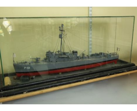 A model of P101 bearing the Swedish flag, a likely armed cruiser, 85cm long within a glass cabinet