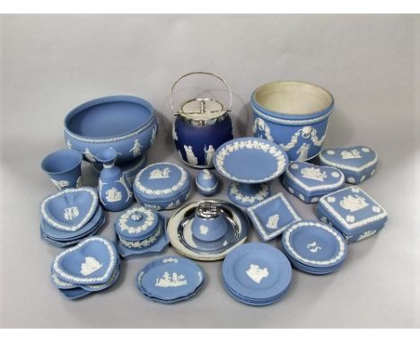 A collection of Wedgwood blue ground jasper wares including a circular footed bowl, a jardiniere, various trinket boxes and c
