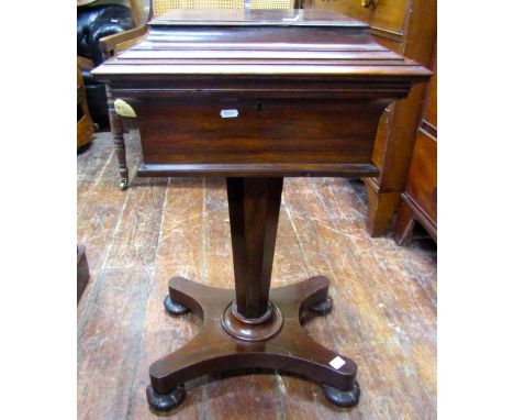 A mid-19th century rosewood ladies sewing table, the rising lid revealing a fitted and buttoned satin interior, raised on a t