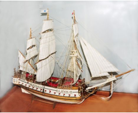 A model of the American three mast schooner Bon Homme Richard, under full sail, 80cm long approx, within mahogany and glass c