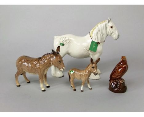 A Beswick model of a standing shire horse with dapple grey patches on a white ground, a Beswick donkey and foal and a Beswick