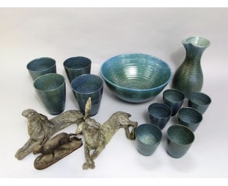A collection of Studio Pottery wares, all with blue glaze, including a circular bowl, ewer, six beakers and four larger beake