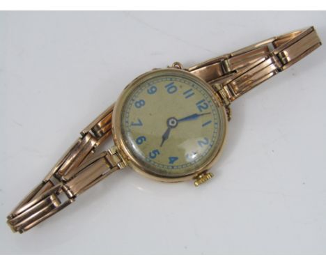 Vintage 9ct cocktail watch, the champagne dial with blue Arabic numerals, 9ct link strap, 16.2 grams gross