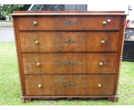 A mid-19th century mahogany continental commode fitted with four long graduated drawers, with well matched flamed veneers, wi