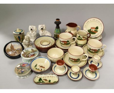 A collection of Torquay wares including two jugs, a set of six plates with various motto inscriptions, together with a Gouda 