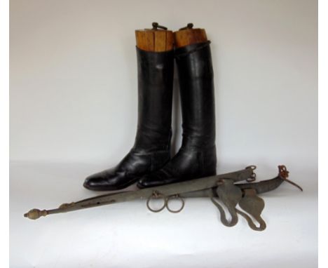 A vintage pair of leather riding boots with trees, together with a pair of horse hames (4)