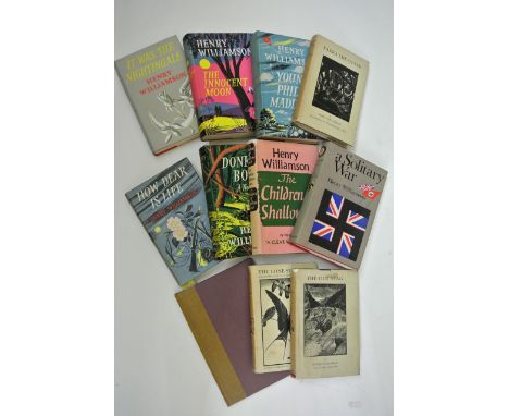 A large quantity of books by Henry Williamson, many first editions and with original dust wrappers, including two titles illu