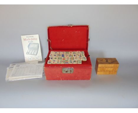 A vintage Morocco leather cased Mahjong set; together with Mahjong scoring cards and an eastern marquetry box fitted with two
