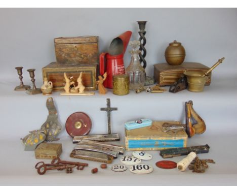 A mixed miscellaneous lot to include candlesticks, marquetry boxes, harmonicas, land tape, Lipton brass caddy, etc