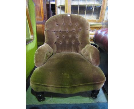 A Victorian spoonback drawing room chair with chocolate brown velvet coloured upholstery, shaped outline and button back rais