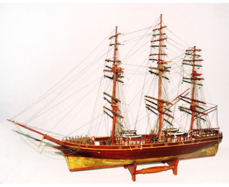 A timber model of a 19th century three mast schooner, 90cm long approx
