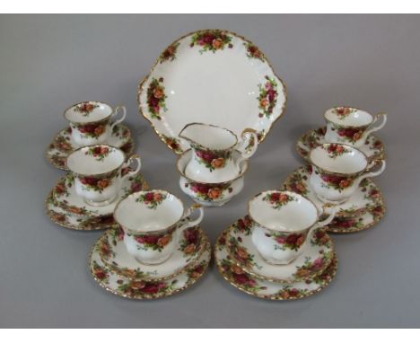 A six place Royal Albert Old Country Roses pattern tea service comprising milk jug, sugar bowl, cake plate, six cups, six sau