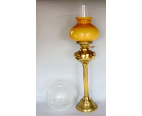 A brass Corinthian column oil lamp with glass shade, 60cm high