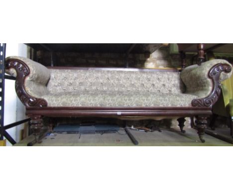 A regency mahogany scroll end sofa, with applied carved detail, raised on turned supports, 115cm wide