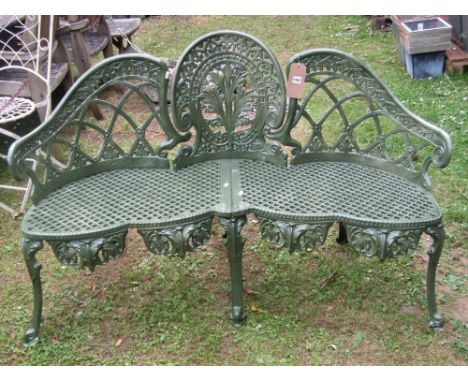 A Victorian style cast aluminium garden bench the seat with serpentine outline and pierced lattice detail beneath further lat