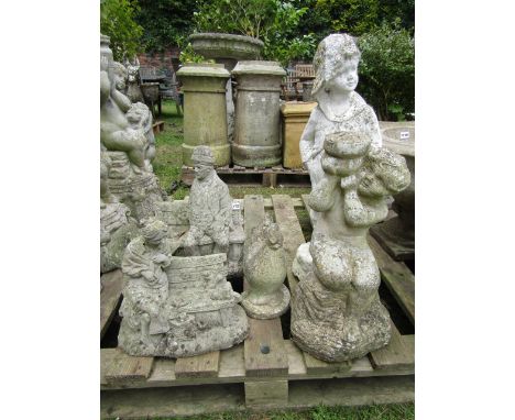 A weathered contemporary cast composition stone bird bath support in the form of a seated cherub, figure of a boy, further or