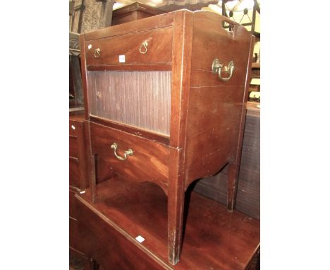 A Georgian mahogany tray top commode, the front elevation enclosed by a frieze drawer, tambour panel and pullout, on square t