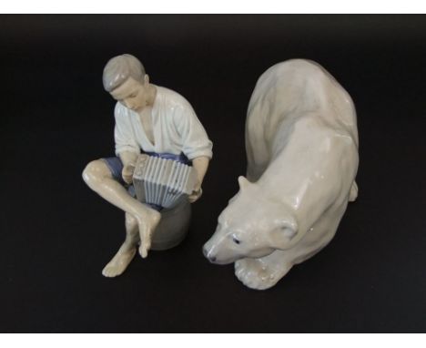 A Royal Copenhagen model of a polar bear with painted mark to base and numbers 1137, 27cm long approx, together with a B & G 