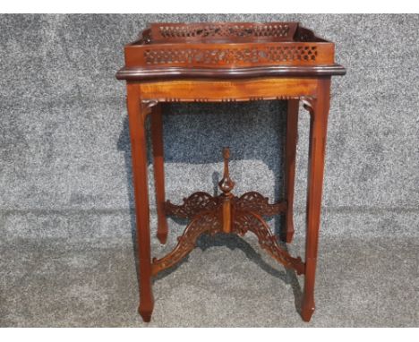 A mahogany Chippendale style silver or centre table with pierced gallery and stretchers 50 x 72cm.