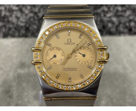 Omega gents Bi-metal Constellation watch. Gold with champagne diamond dot dial, diamond bezel and quartz movement, chronomete