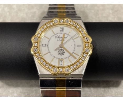 Chopard ladies Bi-metal watch. Featuring white dial with Roman numerals and gold batons. Date display and diamond bezel with 