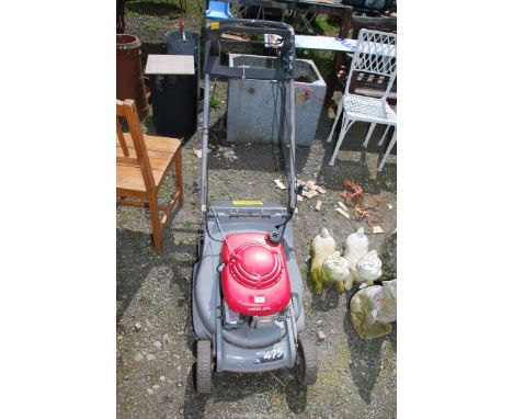 A Honda mower, engine turns at time of lotting but no blade and pull cord broken.
