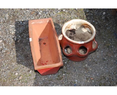 A strawberry planter and a trough.