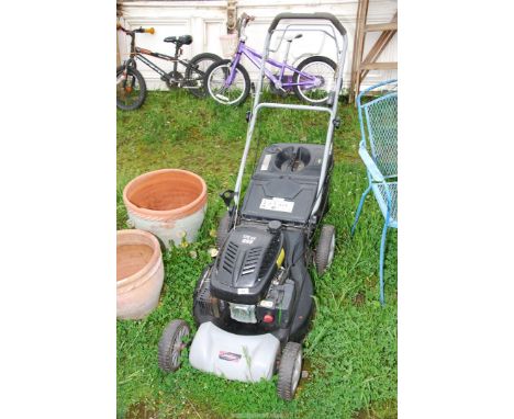 A Lawn King 98 lawn mower 173 cc overhead valve engine, good compression, with grass box.