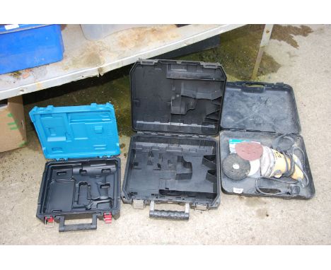 An empty 'Erbauer' case, Dewalt case and Wolfe Mouse sander.