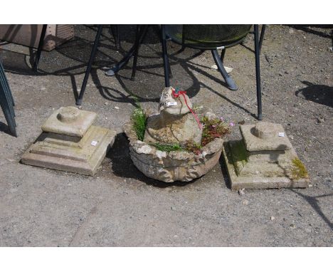 A concrete planter, a/f and three concrete bases.