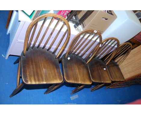 Four stick back chairs.