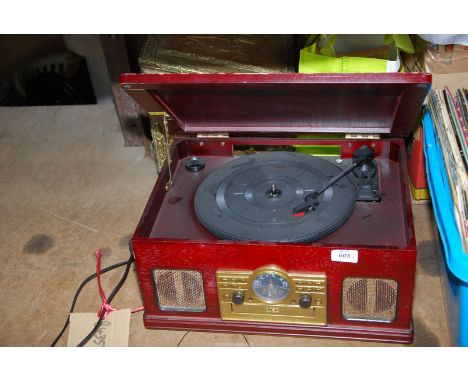 A radio/record/disc player (not working at time of lotting).