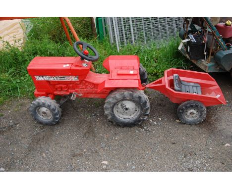 A child's 'Case' tractor and trailer.