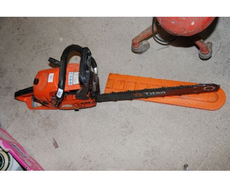 A Titan chainsaw, chain brake working, good compression at time of lotting.