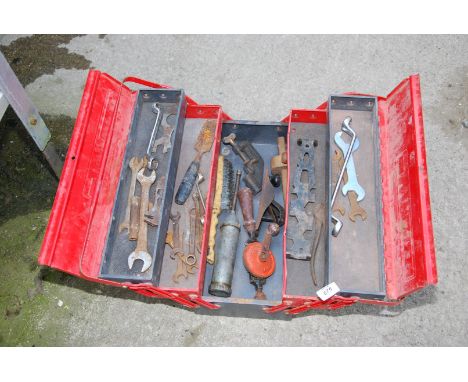 A cantilever tool box, spanners, hand drill, grease gun, wire brush etc.
