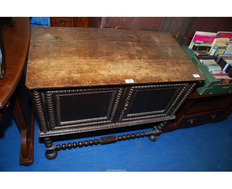 A hall cupboard with bobbin legs, 34 1/2" x 19" x 29" high.
