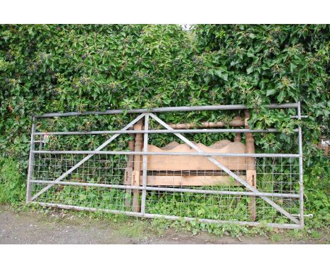 A galvanised farm gate with mesh to base, 118'' wide.