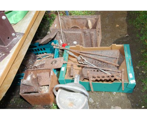 A quantity of fire irons, watering can, old biscuit tin, tools, boot scraper, etc.
