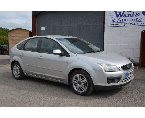 A Ford Focus Ghia T 1596 cc petrol-engined five door Saloon motor Car, finished in silver, registration No. CK05 GWX, first r