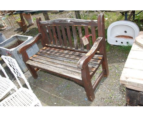 A wooden bench, 47 1/2'' wide x 34'' high.
