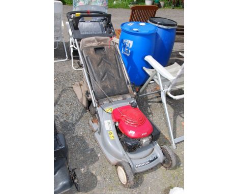 A Honda HRB475 lawn mower with a roller, (good compression at time of lotting), plus two grass boxes.
