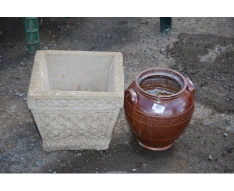 A glazed urn and concrete planter.