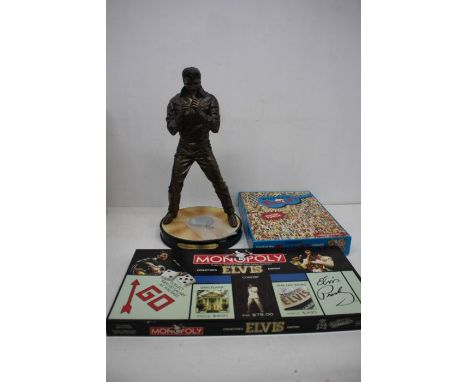 A box of Elvis music memorabilia including a puzzle - Monopoly,Harley Davidson Cap - Some pins and buttons - Stamp first day 