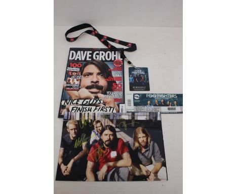 Foo Fighters signed photograph with Tour Pass, magazine and ticket stubs