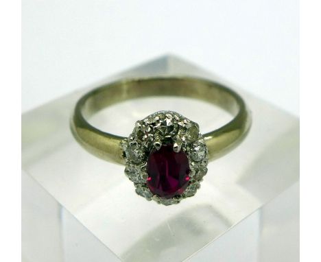 An 18ct gold, diamond and ruby ring, weight 4.1g, size N, hallmark worn