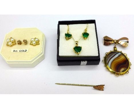 A pair of 9ct gold and pearl earrings, a pair of 9ct gold earrings, a pendant and earrings set, a yellow metal brooch and a s