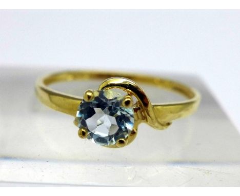 A 9ct gold and blue topaz ring, weight 0.9g, size O