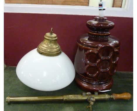 A brass pump, The Florists Friend, a table lamp base and a ceiling light